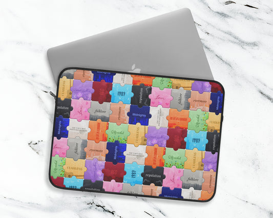 The Eras puzzles laptop sleeve